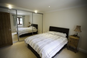 Double bed and mirrored wardrobes